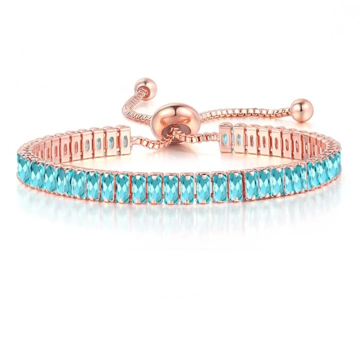 Bratara tennis Reese, auriu rose, cu pietre bleu dreptunghiulare de zirconiu, reglabila