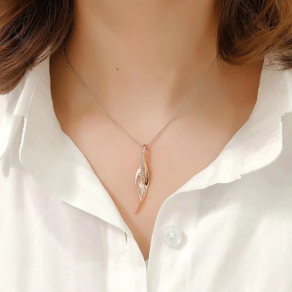 Gala Necklace, rose gold and silver mix, decorated with cubic zirconia and 18K gold plated, with a leaf-shaped pendant